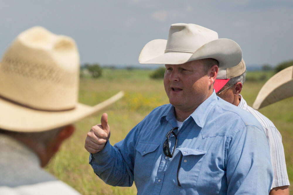 Noble consultant, Jeff Goodwin, speaks with a group of ranchers.